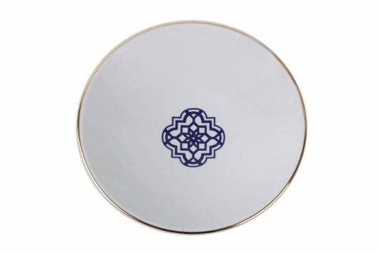 Assiette en porcelaine évoquant l'atmosphère mystique du Maroc avec des motifs bleu majorelle rehaussés d'éclat d'or.