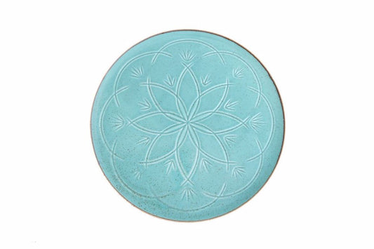 eclatante assiette turquoise à reliefs parfaite pour une decoration maison authentique et une atmosphere sophistiquee au Maroc