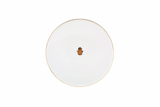 assiette creuse en porcelaine aux motifs ethniques, mêlant turquoise et blanc reflétant leclat et lauthenticité du Maroc