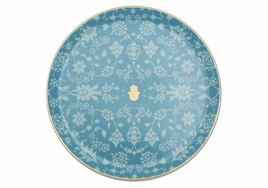 Assiette plate turquoise à motifs inspirée de la décoration des maisons du Maroc, mêlant éthique et éclat.