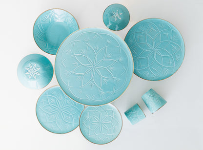 service de table turquoise motif relief