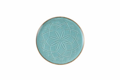 Une assiette turquoise à reliefs de 18cm refletant lauthenticite de la tradition marocaine tout en apportant un eclat moderne à la decoration des maisons